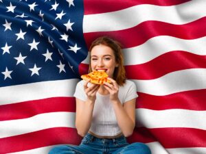 Bandiera americana e ragazza che mangia